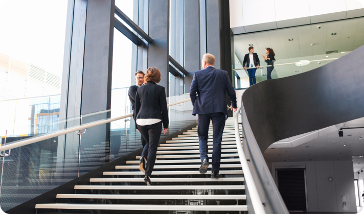 people-walking-up-office-stairs