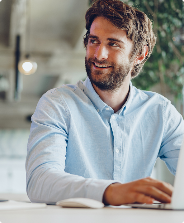 person-smiling-at-laptop